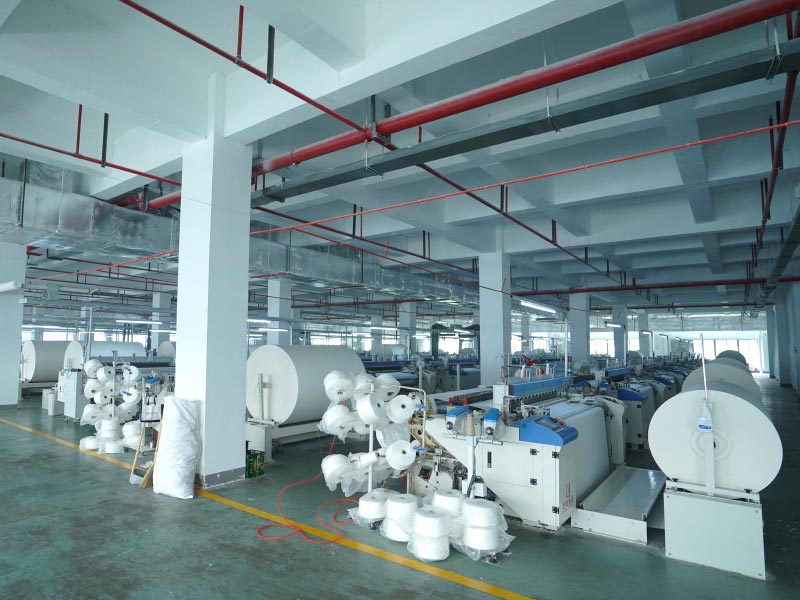 Air jet loom with jumbo roll
