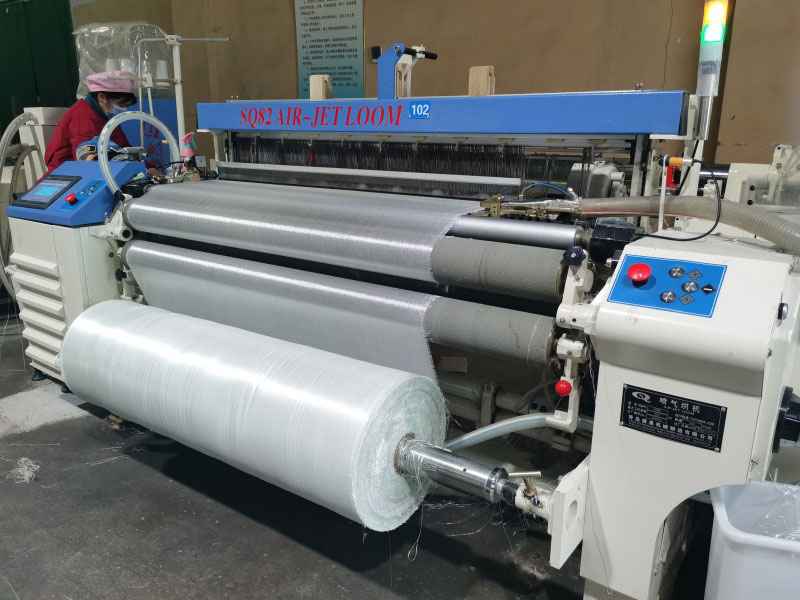 Fiberglass fabric air jet weaving loom